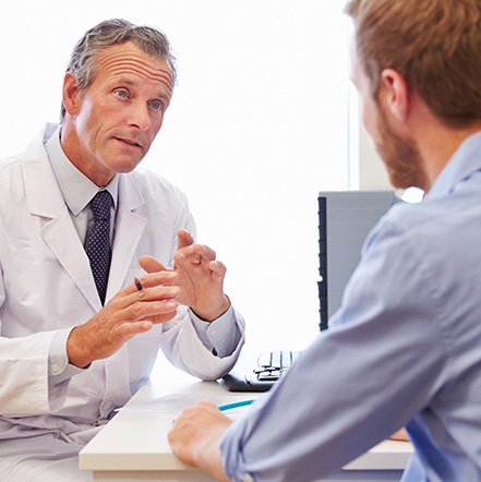 a doctor consults with a patient